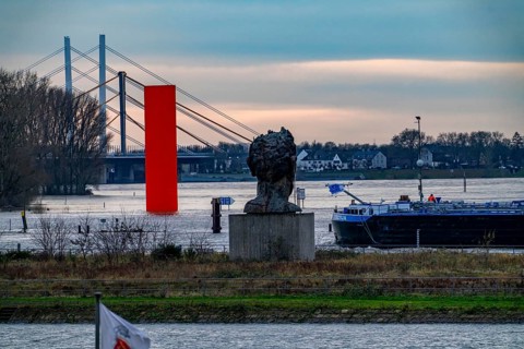 Flood on the Rhine near Duisburg, freighter in the harbour canal, Neuenkamp Rhine Bridge, old and