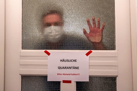 Symbolic image Domestic quarantine, man is in isolation at home due to a suspected corona