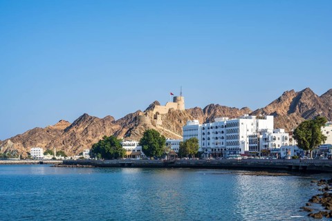 Mutrah Corniche with fort, promenade at the harbour, Matrah, Muscat, Oman, Asia