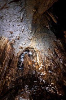 Man in a stalactite cave, Terciopelo Cave, Barra Honda National Park, Costa Rica, Central America