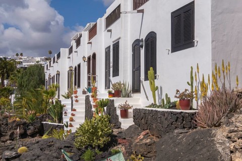 Typical white houses on the promenade of Puerto del Carmen, Lanzarote, Canary Islands, Spain,