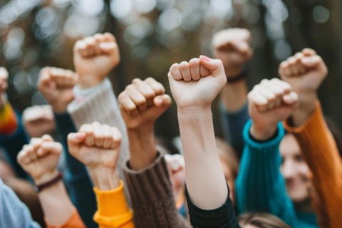Close up of many women's raised fists. KI generiert, generiert, AI generated
