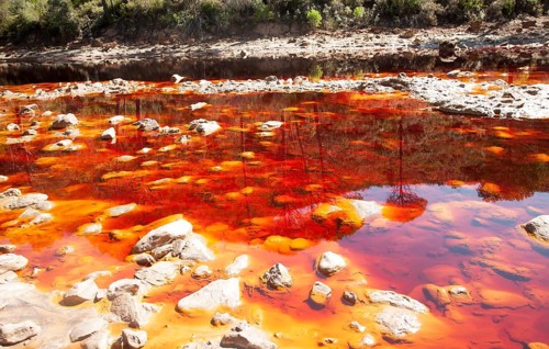 Blood red mineral laden water Rio Tinto river Minas de Riotinto mining area, Huelva province,