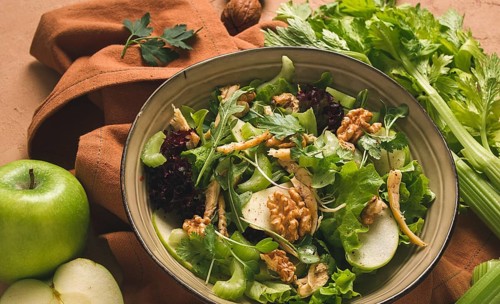 Fresh, Waldorf salad, celery stalk with chicken, apple and walnut, grapes, herbs, homemade, no