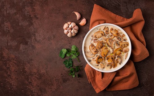 Champignons in creamy garlic sauce, with herbs and spices, gravy, sauce, no people