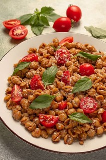 Tuscan pasta with smoked paprika and basil, parmesan cheese, Italian traditional cuisine