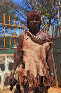 Southern Ethiopia, woman of the Hammer people in Dimeka, dress made of goatskin and hair dyed with
