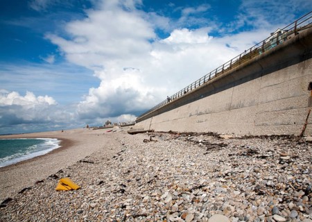 Shingle beach and large sea wall providing coastal defence at Chiswell, Isle of Portland, Dorset,
