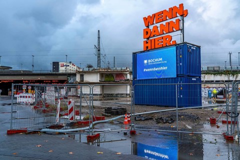 Central station, construction site for a new building, illuminated advertising, neon sign, digital