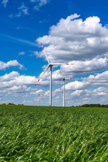 Wind farm, wind turbine, wind turbines from the manufacturer Enercon, blue sky with many white