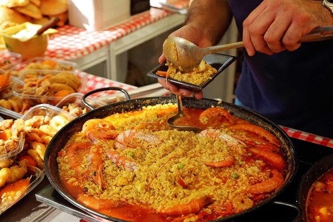 Paella preparation, street market stand near Barcelona Cathedral square