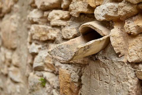 Natural stone wall with rainwater drain La Roque-sur-Cèze, Département Gard, Occitanie region,