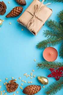 Christmas or New Year composition. Decorations, box, cinnamon, cones, fir and spruce branches, cup