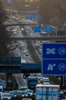 Motorway A40, Ruhrschnellweg, near Bochum, dense evening traffic, in front of the motorway junction