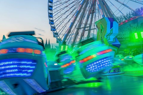 Deutz funfair on the Rhine, at Easter, funfair, break-dancer ride, Ferris wheel, Cologne Cathedral,