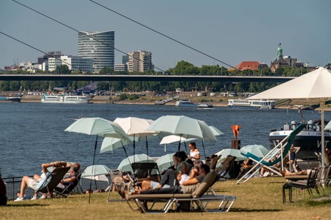 The city beach on the Rhine near Düsseldorf, riverside promenade, by the Rheinkniebrücke bridge,