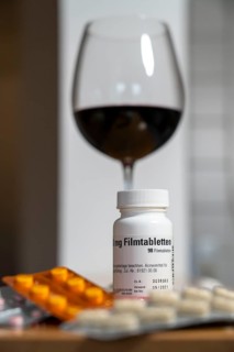 Symbolic image, taking medication and alcohol, should not be done, alcohol and medicine are not