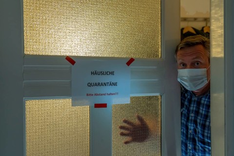 Symbolic image Domestic quarantine, man is in isolation at home due to a suspected corona
