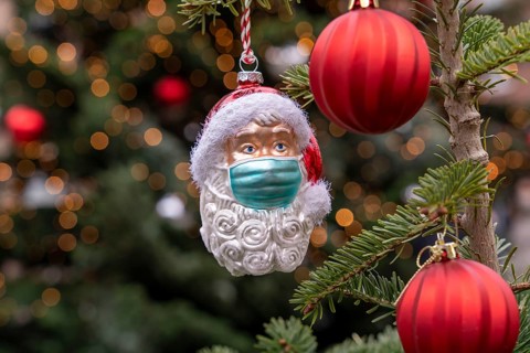Symbolic image of Christmas in the Corona crisis, Father Christmas figure, Christmas tree