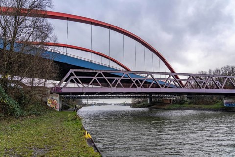 Dilapidated A42 motorway bridge (red arches) over the Rhine-Herne Canal, with massive structural