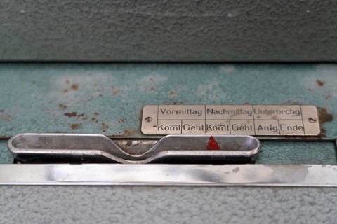 Mechanical time clock, analogue recording of working time, symbolic image