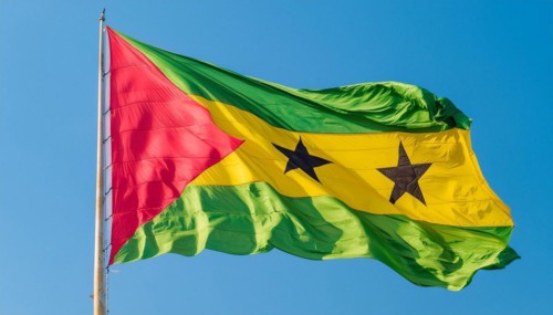 The flag of the Democratic Republic of Sao Tome, Africa, flutters in the wind, isolated against a