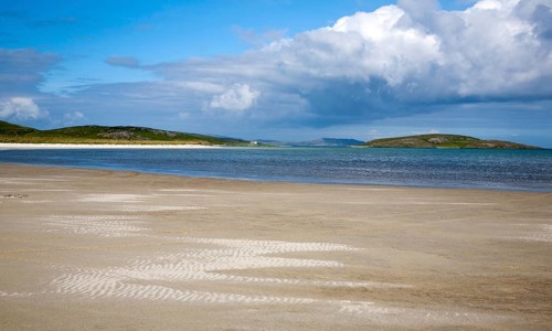 White sand at Traigh Mhor beach, the Cockle Strand, Barra, Outer Hebrides, Scotland, UK