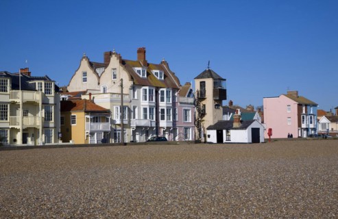 Seaside buildings along the front, Aldeburgh, Suffolk, England. Disused lifeboat station building