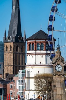 Rhine promenade in Düsseldorf, Ferris wheel, old castle tower, St Lambert's Basilica, old town,