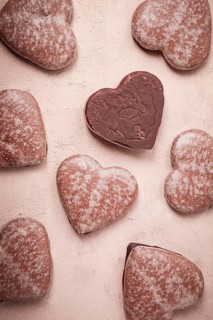 Food wallpaper, chocolate glazed gingerbread, heart-shaped, top view, no people