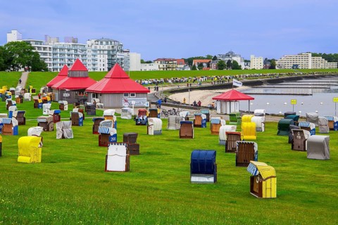 Grassy beach on the dyke with beach chairs in the Grimmershörn district, North Sea spa town of