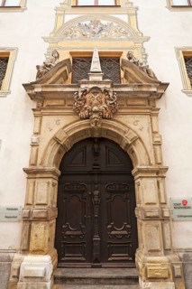 Entrance portal with the alegories of Faith and Peace from the Baroque town hall from 1661,