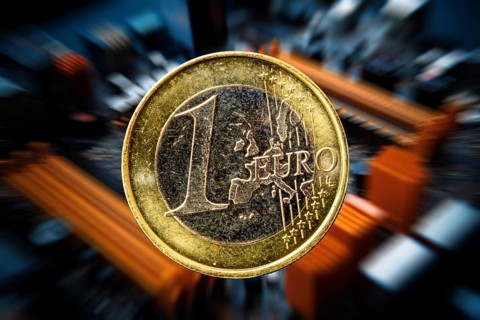 Symbolic image of the digital euro: one-euro coin against a virtual background