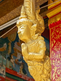 Gilded deity statue, Wat Phonxay, Luang Prabang, Laos, Asia