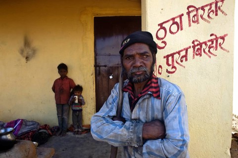 Portrait of a man and children belonging to the Birhor tribe, Jharkhand, India. They are standing