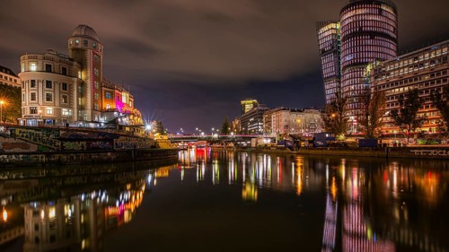 Lights reflected in the Danube Canal, on the left the Urania observatory, on the right illuminated