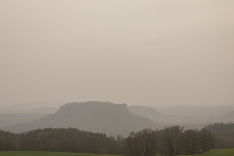 Large amounts of Sahara dust obscure the sun and cloud the distant view to Lilienstein and