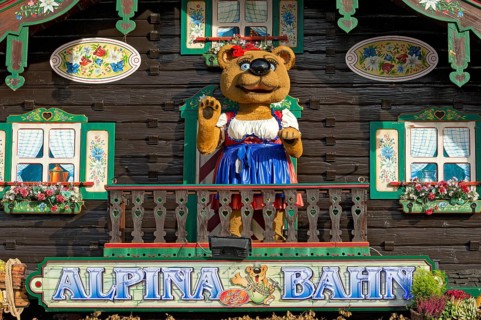 Mountain hut with teddy bear in traditional traditional costume, bear figurine, decoration of the