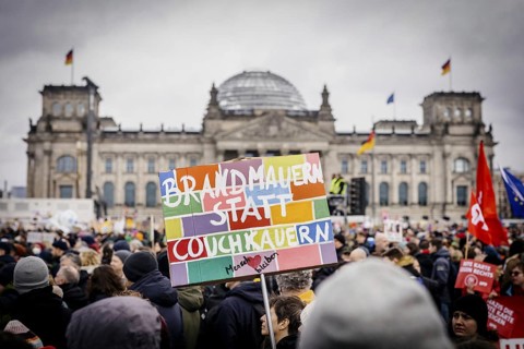 Posters at the large demonstration against the right in Berlin under the slogan We are the firewall