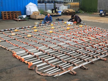 Men working on Dacon Rescue Scoop, Boston Putford Offshore Safety company, Lowestoft, Suffolk,