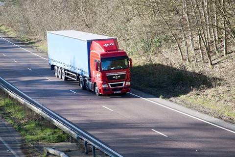 MAN Transport and Forwarding heavy good vehicle on A12 road, Suffolk, England, United Kingdom,