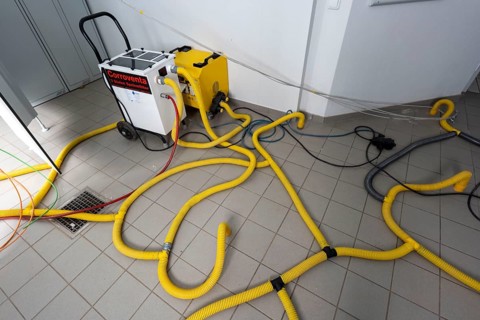 Water damage restoration, dehumidification, after flooding of a building, vacuum drying