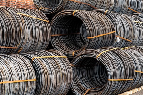 Steel wire, coils, waiting for further processing in the Rhine-Ruhr harbour in Mülheim an der Ruhr,