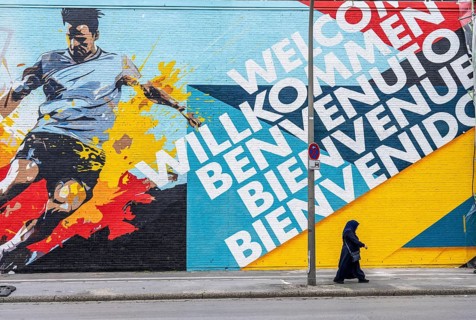 Large-format mural welcoming football fans to EURO 2024 at Dortmund Central Station, North