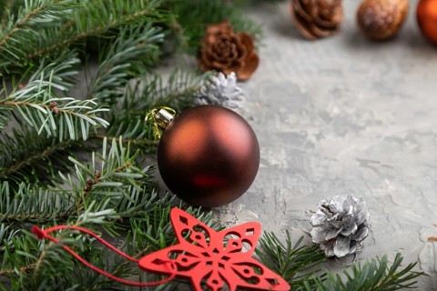 Christmas or New Year composition. Decorations, cones, cinnamon, fir and spruce branches, cup of