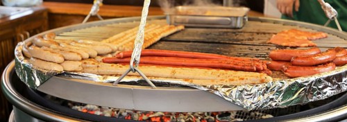 Sausages and steaks on the swing grill