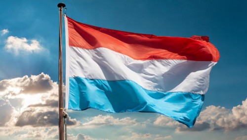 Flags, the national flag of Luxembourg flutters in the wind