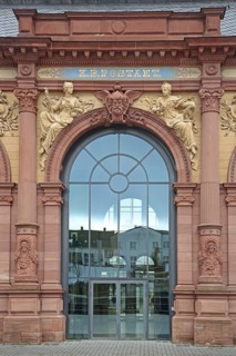 Entrance with stained glass window to the Old Post Office built in 1893 with decorations and