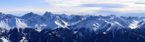 Alpine panorama with snow-covered mountain peaks in winter. Taken in the ski resort of Serfaus Fiss