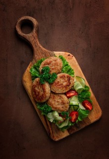 Fried cutlets, turkey, with vegetable salad, top view, no people